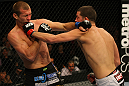 LAS VEGAS, NV - DECEMBER 30:  Donald Cerrone (left) and Nate Diaz (right) exchange blows during the UFC 141 event at the MGM Grand Garden Arena on December 30, 2011 in Las Vegas, Nevada.  (Photo by Donald Miralle/Zuffa LLC/Zuffa LLC via Getty Images) *** Local Caption *** Donald Cerrone; Nate Diaz