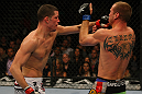 LAS VEGAS, NV - DECEMBER 30:  Nate Diaz (left) punches Donald Cerrone (right) during the UFC 141 event at the MGM Grand Garden Arena on December 30, 2011 in Las Vegas, Nevada.  (Photo by Donald Miralle/Zuffa LLC/Zuffa LLC via Getty Images) *** Local Caption *** Nate Diaz; Donald Cerrone