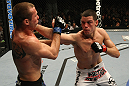 LAS VEGAS, NV - DECEMBER 30:  Nate Diaz (right) punches Donald Cerrone during the UFC 141 event at the MGM Grand Garden Arena on December 30, 2011 in Las Vegas, Nevada.  (Photo by Donald Miralle/Zuffa LLC/Zuffa LLC via Getty Images) *** Local Caption *** Nate Diaz; Donald Cerrone