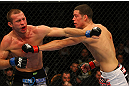 LAS VEGAS, NV - DECEMBER 30:  Donald Cerrone (left) and Nate Diaz (right) exchange blows during the UFC 141 event at the MGM Grand Garden Arena on December 30, 2011 in Las Vegas, Nevada.  (Photo by Donald Miralle/Zuffa LLC/Zuffa LLC via Getty Images) *** Local Caption *** Donald Cerrone; Nate Diaz