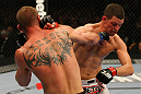 LAS VEGAS, NV - DECEMBER 30:  Donald Cerrone (left) and Nate Diaz (right) exchange blows during the UFC 141 event at the MGM Grand Garden Arena on December 30, 2011 in Las Vegas, Nevada.  (Photo by Donald Miralle/Zuffa LLC/Zuffa LLC via Getty Images) *** Local Caption *** Donald Cerrone; Nate Diaz