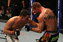 LAS VEGAS, NV - DECEMBER 30:  Nate Diaz (left) hits Donald Cerrone with a punch to the body during the UFC 141 event at the MGM Grand Garden Arena on December 30, 2011 in Las Vegas, Nevada.  (Photo by Donald Miralle/Zuffa LLC/Zuffa LLC via Getty Images) *** Local Caption *** Nate Diaz; Donald Cerrone