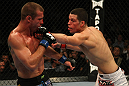 LAS VEGAS, NV - DECEMBER 30:  Nate Diaz (right) punches Donald Cerrone during the UFC 141 event at the MGM Grand Garden Arena on December 30, 2011 in Las Vegas, Nevada.  (Photo by Donald Miralle/Zuffa LLC/Zuffa LLC via Getty Images) *** Local Caption *** Nate Diaz; Donald Cerrone