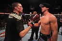 LAS VEGAS, NV - DECEMBER 30:  Nate Diaz (left) and Donald Cerrone (right) shake hands after their fight during the UFC 141 event at the MGM Grand Garden Arena on December 30, 2011 in Las Vegas, Nevada.  (Photo by Donald Miralle/Zuffa LLC/Zuffa LLC via Getty Images) *** Local Caption *** Nate Diaz; Donald Cerrone
