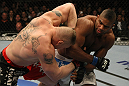 LAS VEGAS, NV - DECEMBER 30:  Alistair Overeem (right) punches Brock Lesnar (left) during the UFC 141 event at the MGM Grand Garden Arena on December 30, 2011 in Las Vegas, Nevada.  (Photo by Donald Miralle/Zuffa LLC/Zuffa LLC via Getty Images) *** Local Caption *** Alistair Overeem; Brock Lesnar
