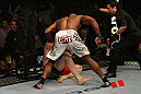 LAS VEGAS, NV - DECEMBER 30:  Alistair Overeem (white shorts) punches Brock Lesnar during the UFC 141 event at the MGM Grand Garden Arena on December 30, 2011 in Las Vegas, Nevada.  (Photo by Donald Miralle/Zuffa LLC/Zuffa LLC via Getty Images) *** Local Caption *** Alistair Overeem