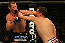 LAS VEGAS, NV - DECEMBER 30:  Donald Cerrone (left) and Nate Diaz (right) exchange blows during the UFC 141 event at the MGM Grand Garden Arena on December 30, 2011 in Las Vegas, Nevada.  (Photo by Donald Miralle/Zuffa LLC/Zuffa LLC via Getty Images) *** Local Caption *** Donald Cerrone; Nate Diaz