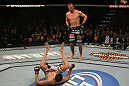 LAS VEGAS, NV - DECEMBER 30:  Donald Cerrone (top) stands over Nate Diaz after a knockdown during the UFC 141 event at the MGM Grand Garden Arena on December 30, 2011 in Las Vegas, Nevada.  (Photo by Donald Miralle/Zuffa LLC/Zuffa LLC via Getty Images) *** Local Caption *** Donald Cerrone; Nate Diaz