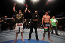 LAS VEGAS, NV - DECEMBER 30:  Nate Diaz (left) is declared the winner in his fight with Donald Cerrone (black shorts) during the UFC 141 event at the MGM Grand Garden Arena on December 30, 2011 in Las Vegas, Nevada.  (Photo by Donald Miralle/Zuffa LLC/Zuffa LLC via Getty Images) *** Local Caption *** Nate Diaz; Donald Cerrone