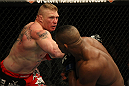 LAS VEGAS, NV - DECEMBER 30:  Brock Lesnar (left) throws a punch at Alistair Overeem during the UFC 141 event at the MGM Grand Garden Arena on December 30, 2011 in Las Vegas, Nevada.  (Photo by Donald Miralle/Zuffa LLC/Zuffa LLC via Getty Images) *** Local Caption *** Brock Lesnar; Alistair Overeem