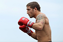 RIO DE JANEIRO, BRAZIL - JANUARY 11:  Chad Mendes works out for the media and fans during the UFC 142 Open Workouts at Barra de Tijuca Beach on January 11, 2012 in Rio de Janeiro, Brazil.  (Photo by Josh Hedges/Zuffa LLC/Zuffa LLC via Getty Images)