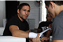 RIO DE JANEIRO, BRAZIL - JANUARY 11:  Chad Mendes has his hands wrapped before the UFC 142 Open Workouts at Barra de Tijuca Beach on January 11, 2012 in Rio de Janeiro, Brazil.  (Photo by Josh Hedges/Zuffa LLC/Zuffa LLC via Getty Images)