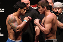 RIO DE JANEIRO, BRAZIL - JANUARY 13:  (L-R) Opponents Thiago Tavares and Sam Stout face off after weighing in during the UFC 142 Weigh In at HSBC Arena on January 13, 2012 in Rio de Janeiro, Brazil.  (Photo by Josh Hedges/Zuffa LLC/Zuffa LLC via Getty Images)