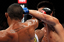 RIO DE JANEIRO, BRAZIL - JANUARY 14:  Yuri Alcantara (R) and Michihiro Omigawa (L) exchange punches in a featherweight bout during UFC 142 at HSBC Arena on January 14, 2012 in Rio de Janeiro, Brazil.  (Photo by Josh Hedges/Zuffa LLC/Zuffa LLC via Getty Images)