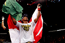 RIO DE JANEIRO, BRAZIL - JANUARY 14:  Yuri Alcantara celebrates after defeating Michihiro Omigawa in a featherweight bout during UFC 142 at HSBC Arena on January 14, 2012 in Rio de Janeiro, Brazil.  (Photo by Josh Hedges/Zuffa LLC/Zuffa LLC via Getty Images)