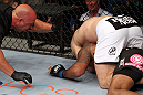 RIO DE JANEIRO, BRAZIL - JANUARY 14:  Referee Dan Miragliotta (L) looks on as Gabriel Gonzaga (Top) chokes out Ednaldo Oliveira (Bottom) in a heavyweight bout during UFC 142 at HSBC Arena on January 14, 2012 in Rio de Janeiro, Brazil.  (Photo by Josh Hedges/Zuffa LLC/Zuffa LLC via Getty Images)
