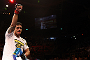 RIO DE JANEIRO, BRAZIL - JANUARY 14:  Thiago Tavares celebrates after defeating Sam Stout in a lightweight bout during UFC 142 at HSBC Arena on January 14, 2012 in Rio de Janeiro, Brazil.  (Photo by Josh Hedges/Zuffa LLC/Zuffa LLC via Getty Images)