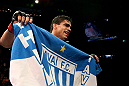 RIO DE JANEIRO, BRAZIL - JANUARY 14:  Thiago Tavares celebrates after defeating Sam Stout in a lightweight bout during UFC 142 at HSBC Arena on January 14, 2012 in Rio de Janeiro, Brazil.  (Photo by Josh Hedges/Zuffa LLC/Zuffa LLC via Getty Images)