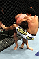 RIO DE JANEIRO, BRAZIL - JANUARY 14:  Thiago Tavares (R) takes down Sam Stout (L) in a lightweight bout during UFC 142 at HSBC Arena on January 14, 2012 in Rio de Janeiro, Brazil.  (Photo by Josh Hedges/Zuffa LLC/Zuffa LLC via Getty Images)