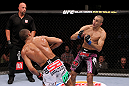 RIO DE JANEIRO, BRAZIL - JANUARY 14:  Edson Barboza (L) knocks out Terry Etim (R) with a spinning back kick in a lightweight bout during UFC 142 at HSBC Arena on January 14, 2012 in Rio de Janeiro, Brazil.  (Photo by Josh Hedges/Zuffa LLC/Zuffa LLC via Getty Images)