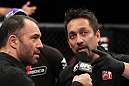 RIO DE JANEIRO, BRAZIL - JANUARY 14:  Referee Mario Yamasaki (R) explains his decision for calling the welterweight bout between Erick Silva and Carlo Prater during UFC 142 at HSBC Arena on January 14, 2012 in Rio de Janeiro, Brazil.  (Photo by Josh Hedges/Zuffa LLC/Zuffa LLC via Getty Images)
