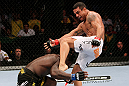 RIO DE JANEIRO, BRAZIL - JANUARY 14:  Vitor Belfort (R) kicks Anthony Johnson (L) in a middleweight bout during UFC 142 at HSBC Arena on January 14, 2012 in Rio de Janeiro, Brazil.  (Photo by Josh Hedges/Zuffa LLC/Zuffa LLC via Getty Images)