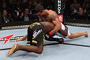 RIO DE JANEIRO, BRAZIL - JANUARY 14:  Vitor Belfort (R) tries to takes down Anthony Johnson (L) in a middleweight bout during UFC 142 at HSBC Arena on January 14, 2012 in Rio de Janeiro, Brazil.  (Photo by Josh Hedges/Zuffa LLC/Zuffa LLC via Getty Images)