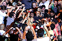 RIO DE JANEIRO, BRAZIL - JANUARY 14:  Jose Aldo (C) celebrates in the crowd after defeating Chad Mendes in a featherweight bout during UFC 142 at HSBC Arena on January 14, 2012 in Rio de Janeiro, Brazil.  (Photo by Josh Hedges/Zuffa LLC/Zuffa LLC via Getty Images)