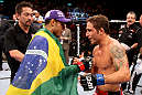 RIO DE JANEIRO, BRAZIL - JANUARY 14: Jose Aldo (L) shakes hands with Chad Mendes (R) after the  featherweight bout during UFC 142 at HSBC Arena on January 14, 2012 in Rio de Janeiro, Brazil. (Photo by Josh Hedges/Zuffa LLC/Zuffa LLC via Getty Images)