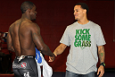 NASHVILLE, TN - JANUARY 18:  (R-L) Tennessee Titans defensive back Cortland Finnegan meets UFC fighter Melvin Guillard during the UFC on FX open workouts at the Nashville MMA Gym on January 18, 2012 in Nashville, Tennessee.  (Photo by Josh Hedges/Zuffa LLC/Zuffa LLC via Getty Images)