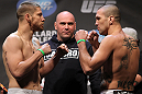 NASHVILLE, TN - JANUARY 19:  (L-R) Welterweight opponents Duane Ludwig and Josh Neer face off after weighing in during the UFC on FX official weigh in at Bridgestone Arena on January 19, 2012 in Nashville, Tennessee.  (Photo by Josh Hedges/Zuffa LLC/Zuffa LLC via Getty Images)