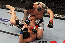 NASHVILLE, TN - JANUARY 20:  (R-L) Daniel Pineda punches Pat Schilling during the UFC on FX event at Bridgestone Arena on January 20, 2012 in Nashville, Tennessee.  (Photo by Josh Hedges/Zuffa LLC/Zuffa LLC via Getty Images)