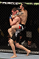 NASHVILLE, TN - JANUARY 20:  (R-L) Daniel Pineda secures a rear choke submission to defeat Pat Schilling during the UFC on FX event at Bridgestone Arena on January 20, 2012 in Nashville, Tennessee.  (Photo by Josh Hedges/Zuffa LLC/Zuffa LLC via Getty Images)