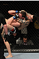 NASHVILLE, TN - JANUARY 20:  (R-L) Daniel Pineda secures a rear choke submission to defeat Pat Schilling during the UFC on FX event at Bridgestone Arena on January 20, 2012 in Nashville, Tennessee.  (Photo by Josh Hedges/Zuffa LLC/Zuffa LLC via Getty Images)