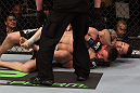 NASHVILLE, TN - JANUARY 20:  (R-L) Daniel Pineda secures a rear choke submission to defeat Pat Schilling during the UFC on FX event at Bridgestone Arena on January 20, 2012 in Nashville, Tennessee.  (Photo by Josh Hedges/Zuffa LLC/Zuffa LLC via Getty Images)