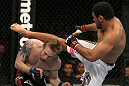 NASHVILLE, TN - JANUARY 20:  (R-L) Fabricio Camoes kicks Tommy Hayden during the UFC on FX event at Bridgestone Arena on January 20, 2012 in Nashville, Tennessee.  (Photo by Josh Hedges/Zuffa LLC/Zuffa LLC via Getty Images)