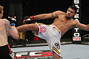 NASHVILLE, TN - JANUARY 20:  (R-L) Fabricio Camoes kicks Tommy Hayden during the UFC on FX event at Bridgestone Arena on January 20, 2012 in Nashville, Tennessee.  (Photo by Josh Hedges/Zuffa LLC/Zuffa LLC via Getty Images)