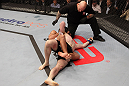 NASHVILLE, TN - JANUARY 20:  (L-R) Fabricio Camoes secures a rear choke submission against Tommy Hayden during the UFC on FX event at Bridgestone Arena on January 20, 2012 in Nashville, Tennessee.  (Photo by Josh Hedges/Zuffa LLC/Zuffa LLC via Getty Images)