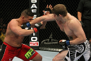 NASHVILLE, TN - JANUARY 20:  (R-L) Christian Morecraft punches Pat Barry during the UFC on FX event at Bridgestone Arena on January 20, 2012 in Nashville, Tennessee.  (Photo by Josh Hedges/Zuffa LLC/Zuffa LLC via Getty Images)