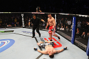 NASHVILLE, TN - JANUARY 20:  Pat Barry (red shorts) reacts after knocking out Christian Morecraft during the UFC on FX event at Bridgestone Arena on January 20, 2012 in Nashville, Tennessee.  (Photo by Josh Hedges/Zuffa LLC/Zuffa LLC via Getty Images)