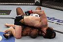 NASHVILLE, TN - JANUARY 20:  (R-L) Charlie Brenneman punches down at Daniel Roberts during the UFC on FX event at Bridgestone Arena on January 20, 2012 in Nashville, Tennessee.  (Photo by Josh Hedges/Zuffa LLC/Zuffa LLC via Getty Images)