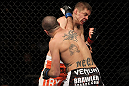 NASHVILLE, TN - JANUARY 20:  (L-R) Josh Neer punches Duane Ludwig during the UFC on FX event at Bridgestone Arena on January 20, 2012 in Nashville, Tennessee.  (Photo by Josh Hedges/Zuffa LLC/Zuffa LLC via Getty Images)