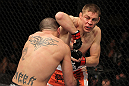 NASHVILLE, TN - JANUARY 20:  (R-L) Duane Ludwig delivers an elbow strike against Josh Neer during the UFC on FX event at Bridgestone Arena on January 20, 2012 in Nashville, Tennessee.  (Photo by Josh Hedges/Zuffa LLC/Zuffa LLC via Getty Images)