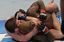 NASHVILLE, TN - JANUARY 20:  (L-R) Jim Miller secures a rear choke submission to defeat Melvin Guillard during the UFC on FX event at Bridgestone Arena on January 20, 2012 in Nashville, Tennessee.  (Photo by Josh Hedges/Zuffa LLC/Zuffa LLC via Getty Images)