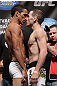 CHICAGO, IL - JANUARY 27:  (L-R) Featherweight opponents Charles Oliveira and Eric Wisely face off after weighing in during the UFC on FOX official weigh in at the Chicago Theatre on January 27, 2012 in Chicago, Illinois.  (Photo by Josh Hedges/Zuffa LLC/Zuffa LLC via Getty Images) *** Local Caption *** Charles Oliveira; Eric Wisely
