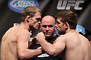 CHICAGO, IL - JANUARY 27:  (L-R) Lightweight opponents Evan Dunham and Nik Lentz face off after weighing in during the UFC on FOX official weigh in at the Chicago Theatre on January 27, 2012 in Chicago, Illinois.  (Photo by Josh Hedges/Zuffa LLC/Zuffa LLC via Getty Images) *** Local Caption *** Nik Lentz; Evan Dunham; Dana White