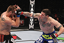 CHICAGO, IL - JANUARY 28:  (R-L) Chris Camozzi punches Dustin Jacoby during the UFC on FOX event at United Center on January 28, 2012 in Chicago, Illinois.  (Photo by Nick Laham/Zuffa LLC/Zuffa LLC via Getty Images) *** Local Caption *** Chris Camozzi; Dustin Jacoby