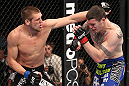 CHICAGO, IL - JANUARY 28:  (L-R) Dustin Jacoby punches Chris Camozzi during the UFC on FOX event at United Center on January 28, 2012 in Chicago, Illinois.  (Photo by Nick Laham/Zuffa LLC/Zuffa LLC via Getty Images) *** Local Caption *** Chris Camozzi; Dustin Jacoby