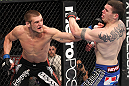 CHICAGO, IL - JANUARY 28:  (L-R) Dustin Jacoby punches Chris Camozzi during the UFC on FOX event at United Center on January 28, 2012 in Chicago, Illinois.  (Photo by Nick Laham/Zuffa LLC/Zuffa LLC via Getty Images) *** Local Caption *** Chris Camozzi; Dustin Jacoby