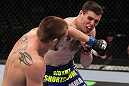 CHICAGO, IL - JANUARY 28:  (L-R) Dustin Jacoby and Chris Camozzi trade punches during the UFC on FOX event at United Center on January 28, 2012 in Chicago, Illinois.  (Photo by Nick Laham/Zuffa LLC/Zuffa LLC via Getty Images) *** Local Caption *** Chris Camozzi; Dustin Jacoby